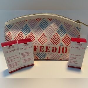 3-pc Clarins Skincare Age Control & Age Replenish with cosmetic bag.